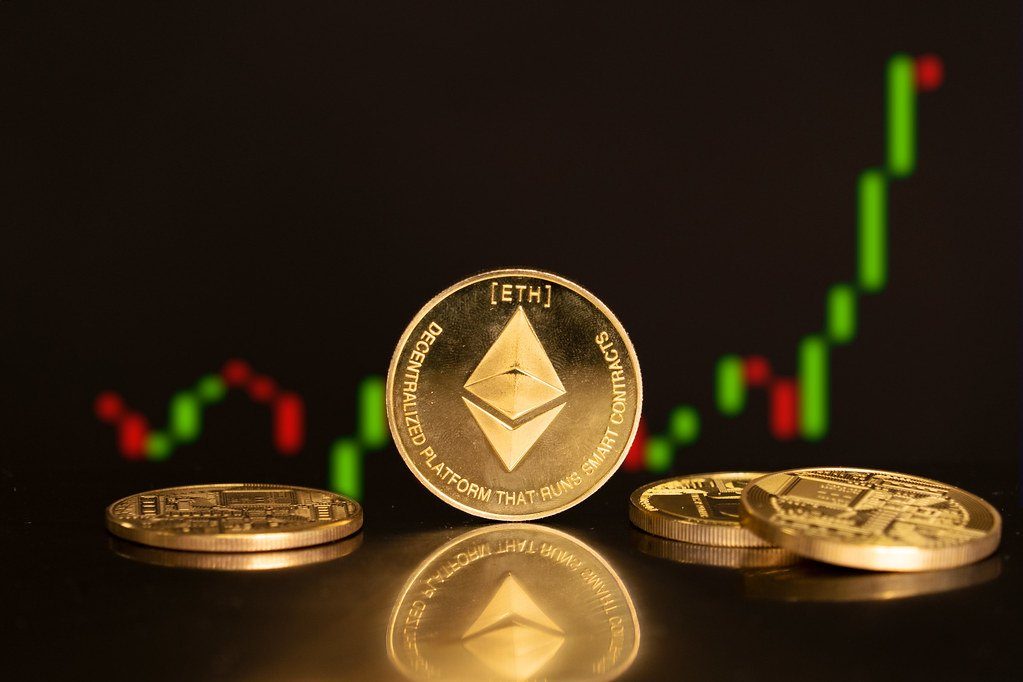 Crypto coins in front of a rising green candlestick chart