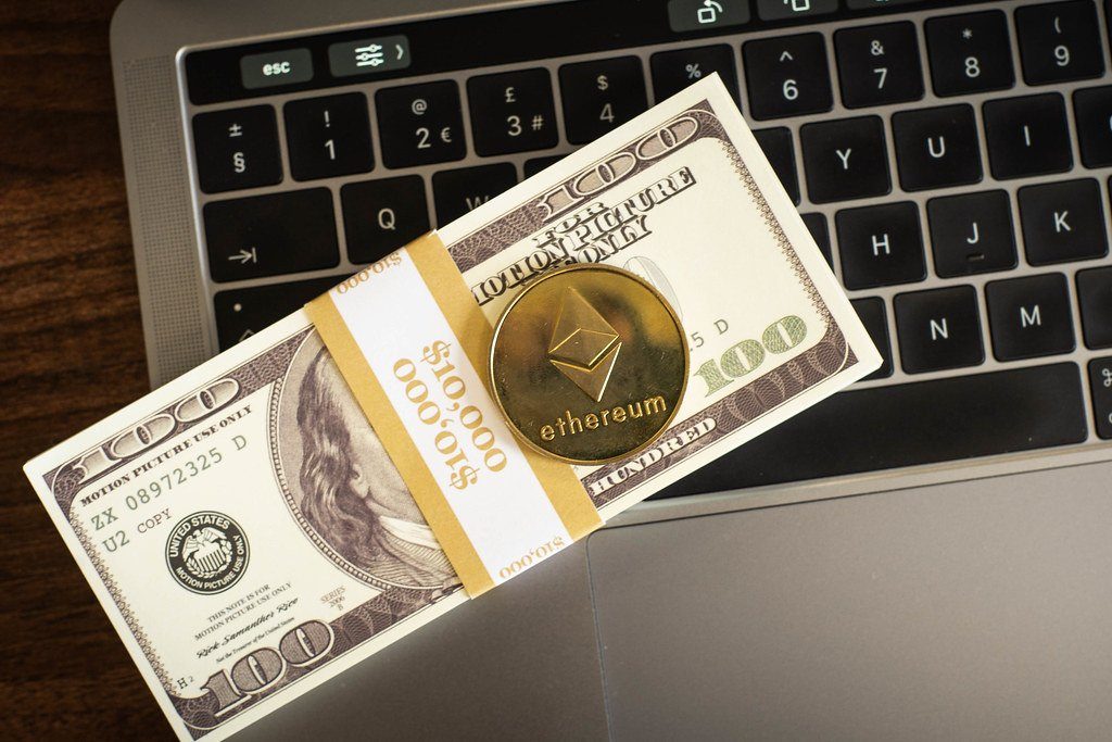 A bundle of novelty banknotes on a laptop keyboard